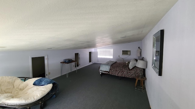 bedroom featuring vaulted ceiling, a wall unit AC, a textured ceiling, and dark carpet