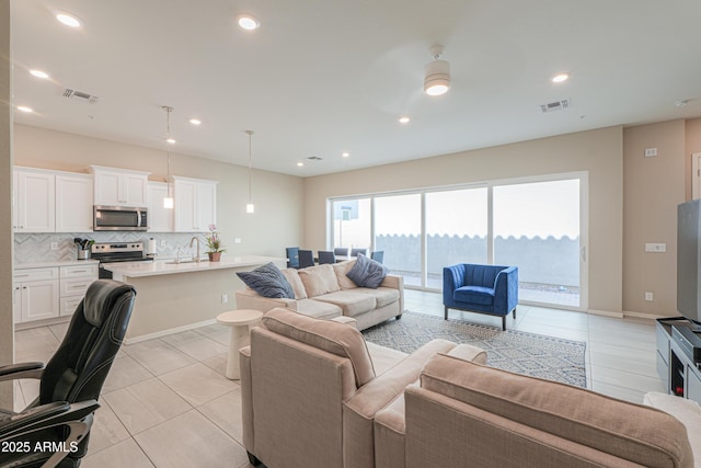 281 E Shamrock Dr, Chandler, AZ 85286 - living room with light tile patterned flooring and recessed lighting