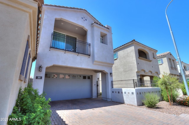 281 E Shamrock Dr, Chandler, AZ 85286 - mediterranean / spanish house featuring a garage, stucco siding, a balcony, decorative driveway, and a tile roof