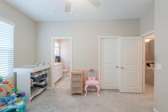 281 E Shamrock Dr, Chandler, AZ 85286 - bedroom featuring light carpet, connected bathroom, and ceiling fan