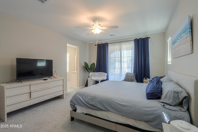 281 E Shamrock Dr, Chandler, AZ 85286 - carpeted bedroom with multiple windows, ensuite bath, and a ceiling fan
