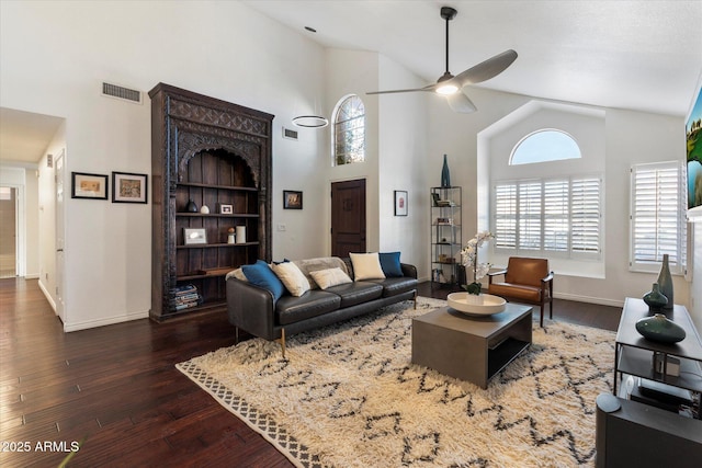 living room with dark wood-type flooring, high vaulted ceiling, and ceiling fan