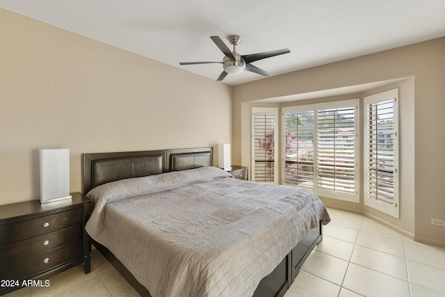 bedroom featuring ceiling fan and light tile patterned flooring