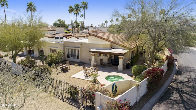 back of property with a patio