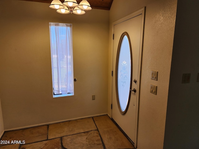 entryway featuring a notable chandelier