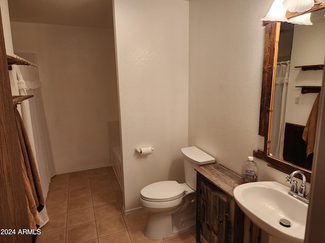 bathroom with tile patterned floors, sink, and toilet