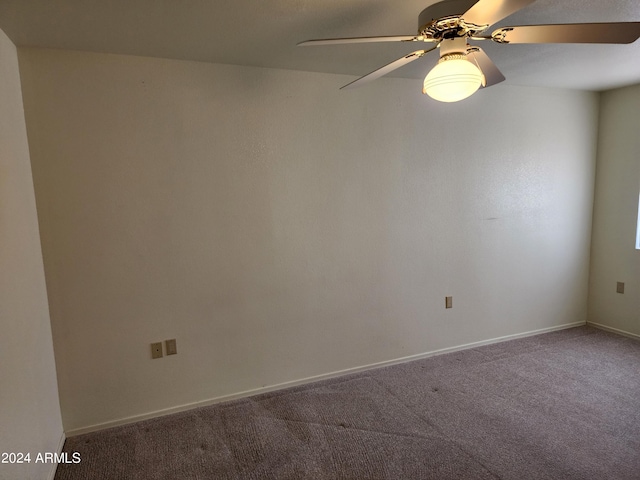 spare room with carpet flooring and ceiling fan