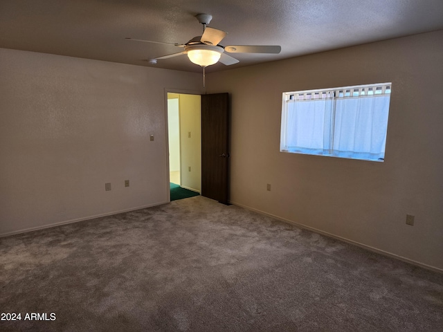 empty room with carpet and ceiling fan