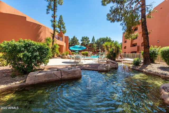 view of swimming pool with a patio area