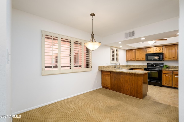 kitchen featuring sink, kitchen peninsula, pendant lighting, light carpet, and black appliances