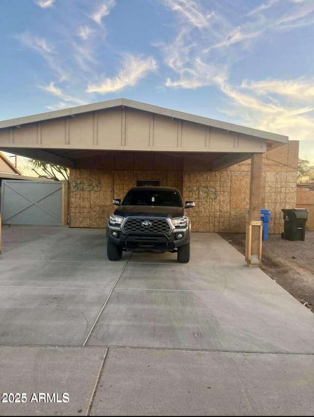 view of parking with a carport and driveway