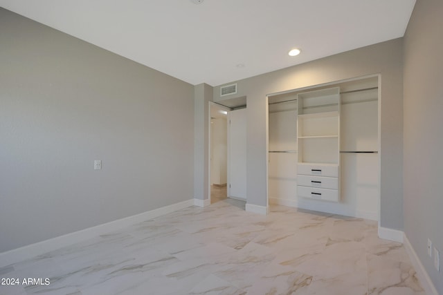 unfurnished bedroom featuring a closet