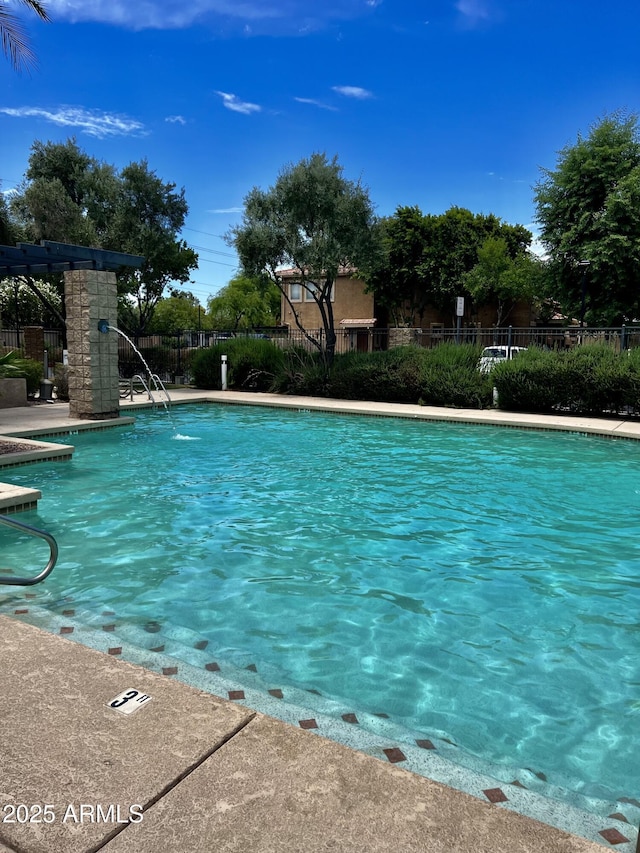 pool featuring fence