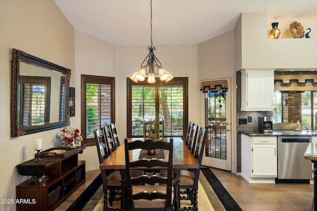 dining area featuring a notable chandelier