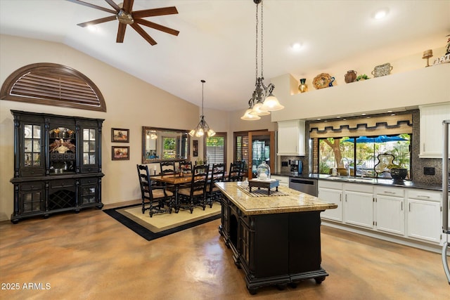 kitchen with dishwasher, white cabinets, concrete floors, ceiling fan with notable chandelier, and backsplash