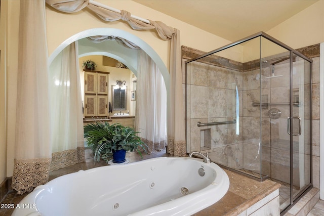 full bath featuring a tub with jets and a stall shower