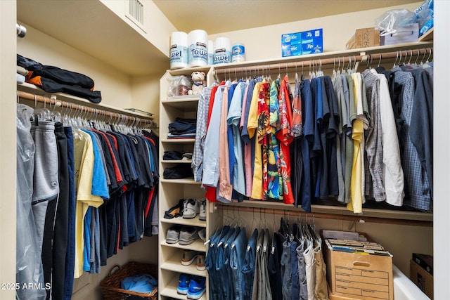spacious closet featuring visible vents