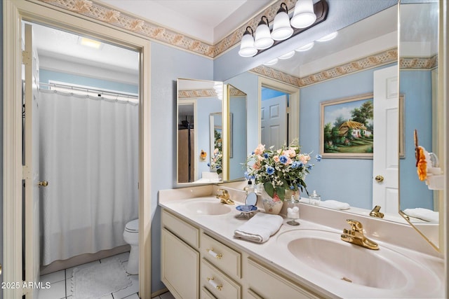 full bathroom with double vanity, toilet, a shower with shower curtain, and a sink