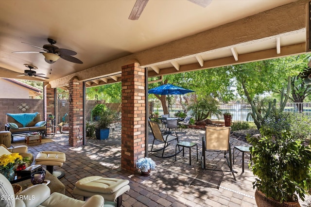 view of patio / terrace featuring outdoor dining area, a fenced backyard, and ceiling fan
