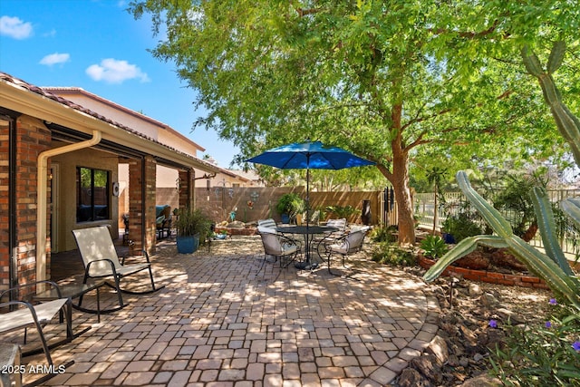 view of patio / terrace with outdoor dining area and a fenced backyard