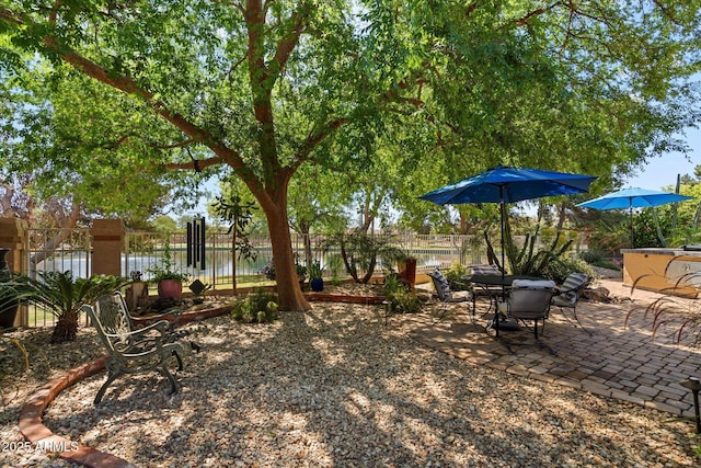 view of yard with fence and a patio area