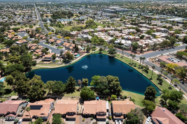 birds eye view of property with a water view and a residential view