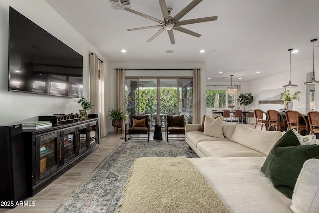1931 E Aster Pl, Chandler, AZ 85286 - living room featuring a ceiling fan, recessed lighting, and light wood finished floors