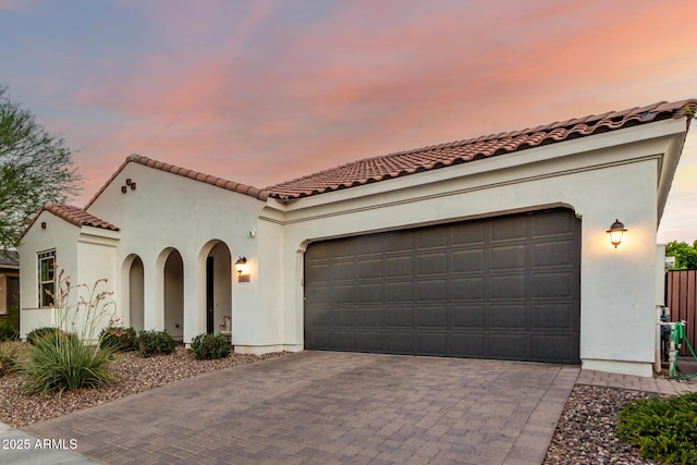 1931 E Aster Pl, Chandler, AZ 85286 - mediterranean / spanish house with decorative driveway, a garage, stucco siding, and a tile roof