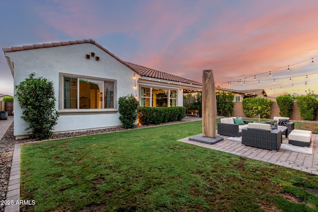1931 E Aster Pl, Chandler, AZ 85286 - back of house featuring outdoor lounge area, a lawn, a patio area, stucco siding, and a tiled roof