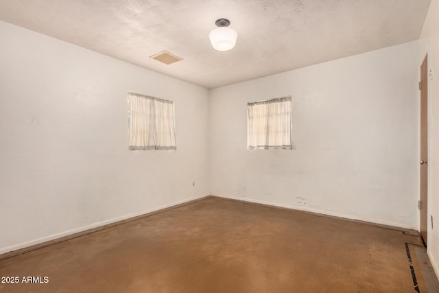2308 W Marlette Ave, Phoenix, AZ 85015 - empty room featuring baseboards, concrete flooring, and visible vents