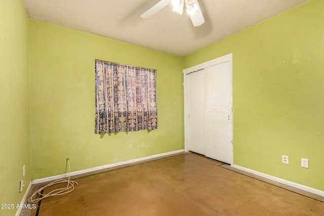 2308 W Marlette Ave, Phoenix, AZ 85015 - unfurnished bedroom featuring baseboards, a ceiling fan, a closet, and concrete floors