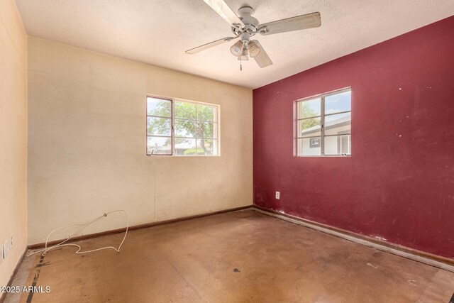 2308 W Marlette Ave, Phoenix, AZ 85015 - spare room with plenty of natural light, a ceiling fan, and concrete floors