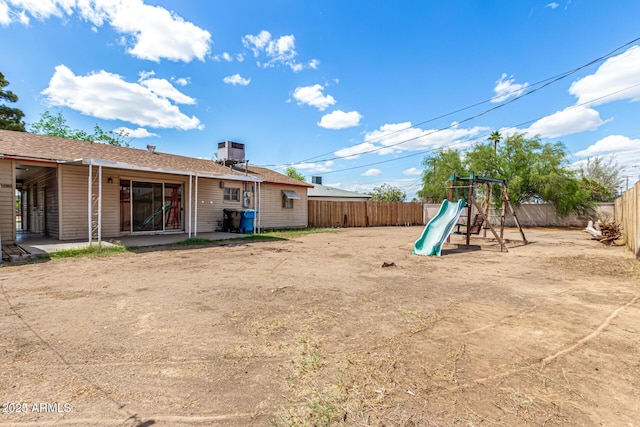 2308 W Marlette Ave, Phoenix, AZ 85015 - view of yard with a fenced backyard and a playground