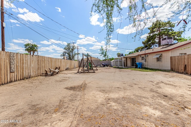 2308 W Marlette Ave, Phoenix, AZ 85015 - view of yard featuring a fenced backyard and a playground