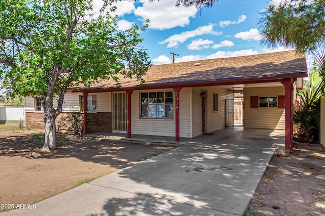 2308 W Marlette Ave, Phoenix, AZ 85015 - ranch-style home with driveway, a shingled roof, and an attached carport