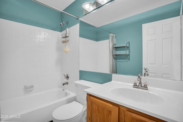 bathroom featuring toilet, bathtub / shower combination, and vanity