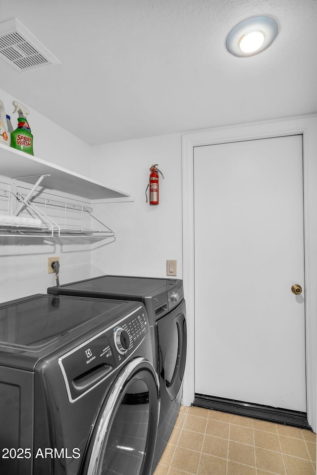 laundry area with washer and dryer