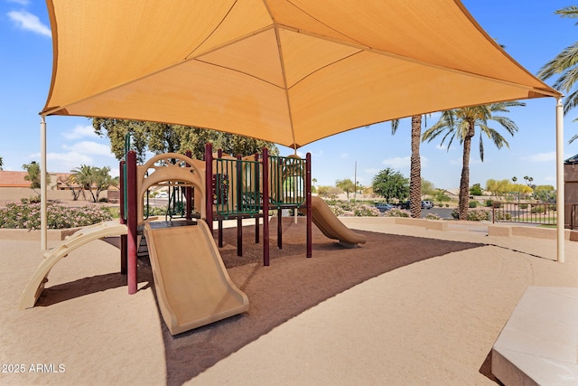 communal playground featuring fence
