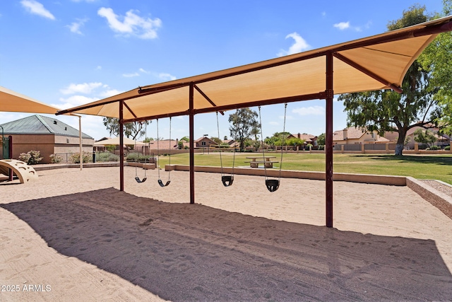 surrounding community featuring a playground and a yard