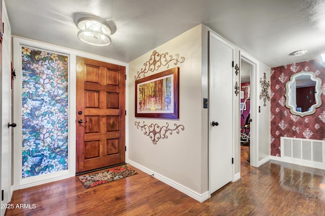 foyer entrance with dark hardwood / wood-style flooring