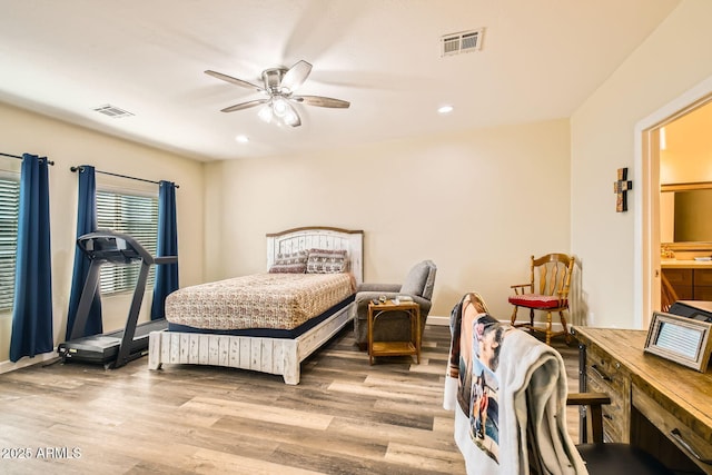 bedroom with ceiling fan and light wood-type flooring