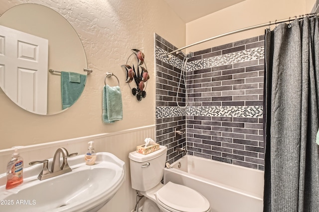 full bathroom featuring shower / tub combo, toilet, and sink