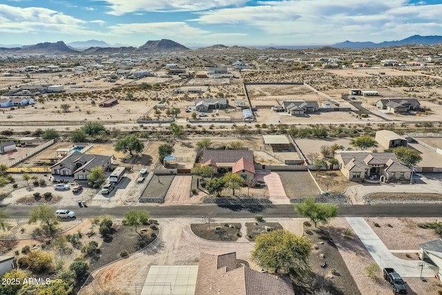 birds eye view of property featuring a mountain view