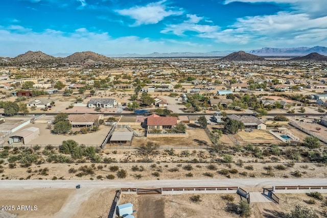 birds eye view of property featuring a mountain view