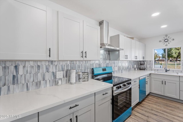 kitchen featuring dishwashing machine, light stone countertops, stainless steel range with electric cooktop, decorative backsplash, and wall chimney range hood