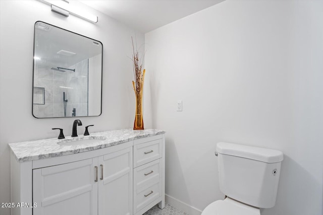 full bathroom with a shower, toilet, vanity, and baseboards