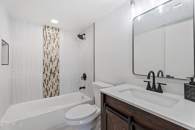 bathroom with visible vents, toilet, vanity, and washtub / shower combination