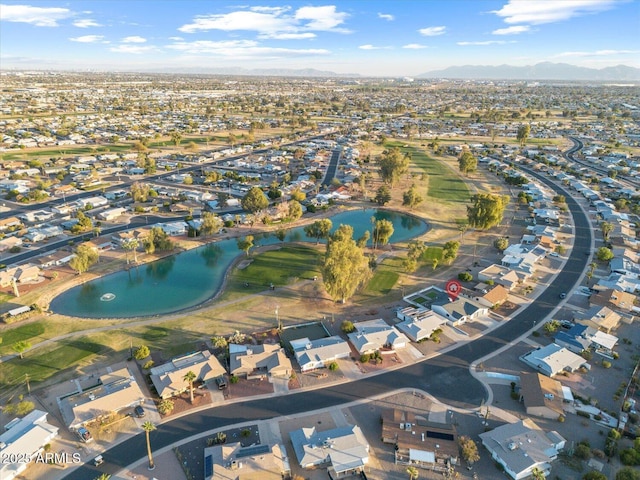 drone / aerial view featuring a residential view and a water and mountain view