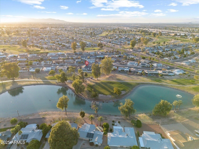 birds eye view of property with a residential view and a water view