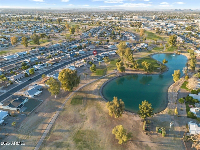 birds eye view of property featuring a residential view and a water view